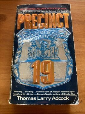 Precinct 19 by Thomas Larry Adcock - Navy Blue Paperback with Metallic Badge
